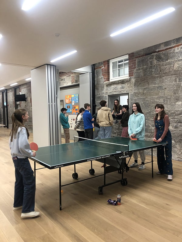 Glow Max playing table tennis